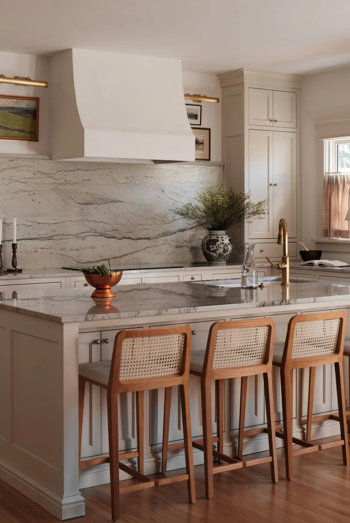 Contemporary kitchen with gray cabinetry, stainless steel, and large island