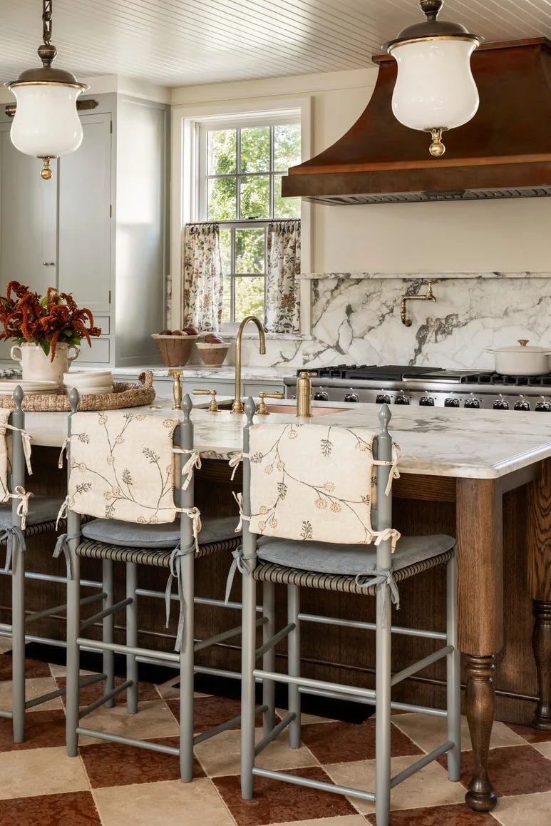 Kitchen in Martha's Vineyard 19th-century home with shiplap and brass